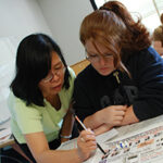 Instructor intently advising a student